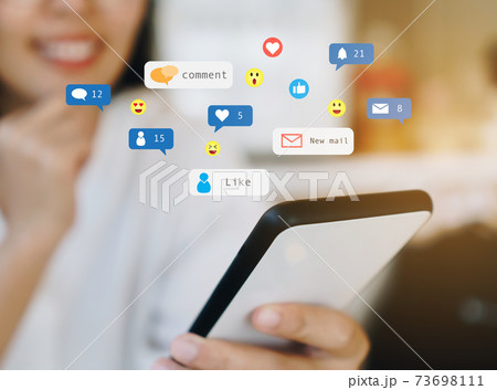 Woman happy play social media on smartphone with communication icon. Technology concept. Woman happy play social media on smartphone with communication icon. Technology concept. 73698111