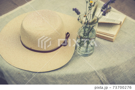 A women summer hat on a table A women summer hat on a table 73700276