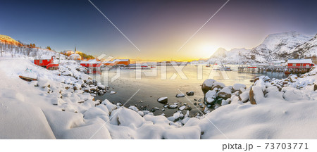 Amazing winter scenery of Moskenes village with ferryport and famous Moskenes parish Churc Amazing winter scenery of Moskenes village with ferryport and famous Moskenes parish Churc 73703771