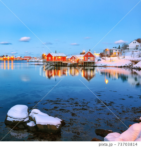 Dramatic evening cityscape of Reine town 73703814