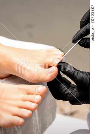 File toenails with nail file File toenails with nail file 73705837