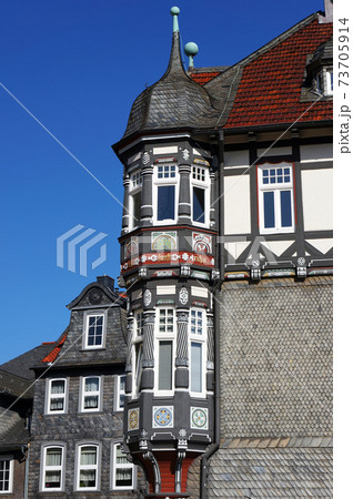 Decorated facade of old medieval house in Goslar, Germany. 73705914
