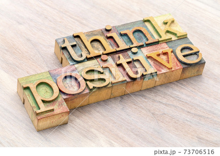 Think positive word abstract in wood type 73706516