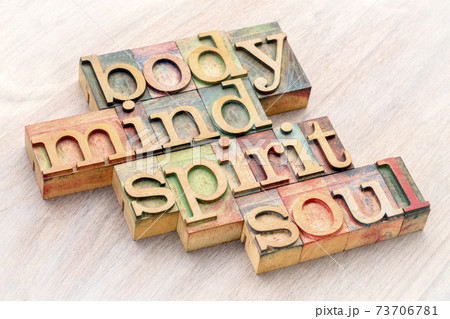 body, mind, spirit and soul word abstract in wood type 73706781