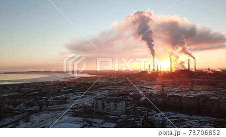 An epic sunset and a Smoking factory. An epic sunset and a Smoking factory. 73706852