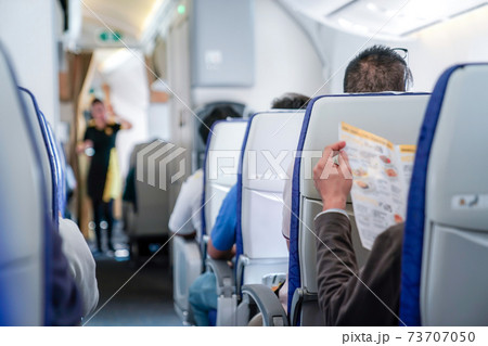 somebody read the menu in the plane, ready order to air hostess. 73707050