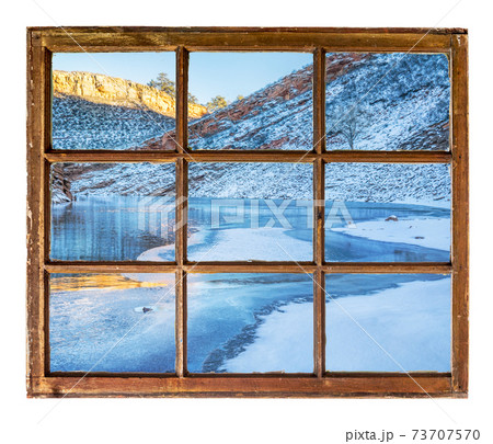 mountain lake in winter window view mountain lake in winter window view 73707570