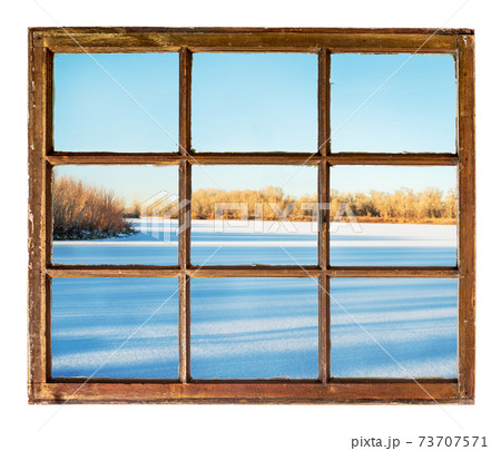 frozen lake with long tree shadows frozen lake with long tree shadows 73707571