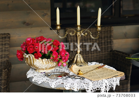 table decoration with flowers and a candle holder, table decor for a candlelit dinner table decoration with flowers and a candle holder, table decor for a candlelit dinner 73708033