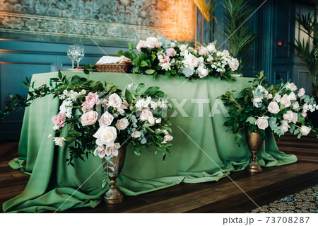 wedding table decoration with flowers on the table in the castle, table decor for dinner by candlelight.Dinner with candles 73708287