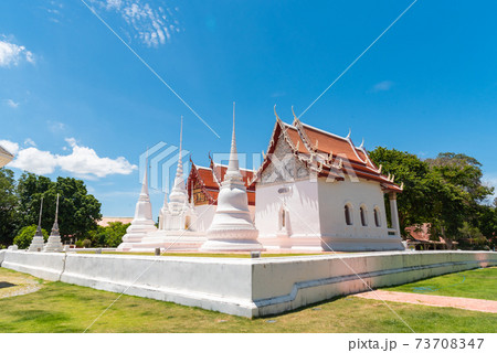 three white pagoda and chapel in Wat Uposatharam, old temple in Uthai thani province, Thailand 73708347