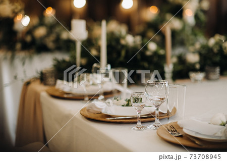 wedding table decoration with flowers on the table, candlelit dinner table decor. 73708945