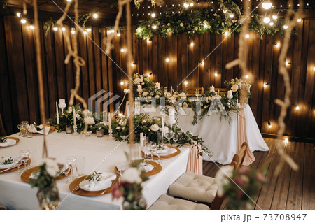 wedding table decoration with flowers on the table, candlelit dinner table decor. 73708947