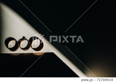 Close-up of two gold wedding rings for a wedding 73709019