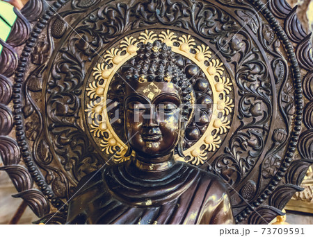 Closeup Tailand buddhism statue: bust Buddha monument with ornament circle background in temple 73709591