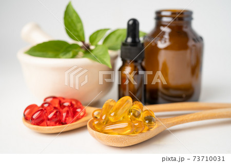 Alternative medicine herbal organic capsule with vitamin E omega 3 fish oil, mineral, drug with herbs leaf natural supplements for healthy good life. Alternative medicine herbal organic capsule with vitamin E omega 3 fish oil, mineral, drug with herbs leaf natural supplements for healthy good life. 73710031