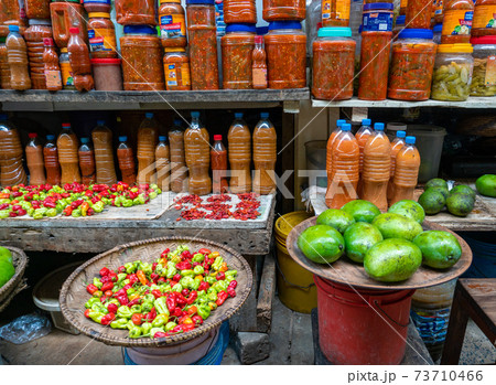 Jars of Peppers and Sauces in a Local Market in Dar es Salaam, Tanzania 73710466