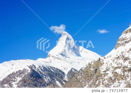 Beautiful view of old village in twilight time with Matterhorn peak background in Zermatt, Switzerland. 73713977