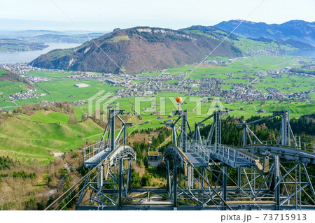View from Mt. Stanserhorn in Switzerland at the beginning of May. The Stanserhorn is a mountain in the Swiss canton of Nidwalden, it is a popular tourist destination. View from Mt. Stanserhorn in Switzerland at the beginning of May. The Stanserhorn is a mountain in the Swiss canton of Nidwalden, it is a popular tourist destination. 73715913