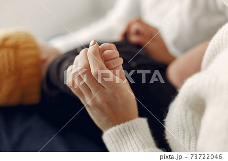 Elegant grandma at home with daughter and grandson Elegant grandma at home with daughter and grandson 73722046