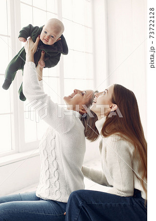 Elegant grandma at home with daughter and granddaughter 73722128
