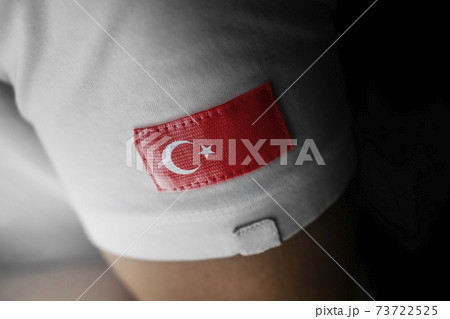 Patch of the national flag of the Turkey on a white t-shirt Patch of the national flag of the Turkey on a white t-shirt 73722525