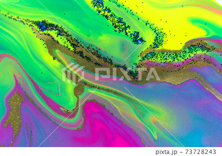 Blue, green and gold glitter on fluorescent liquid ink background. 73728243