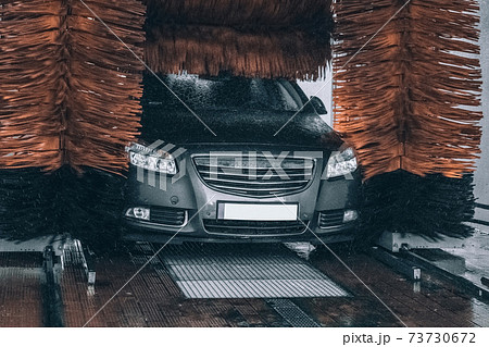 Service clean car. Carwash with water, soap. Hand vehicle auto from foam. 73730672