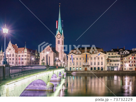 View of Grossmunster and Zurich old town from Limmat river. The Grossmunster is a Romanesque style Protestant church in Zurich, Switzerland 73732229