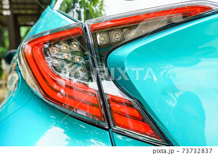 Detail on the rear light of a car. New led taillight by night. 73732837
