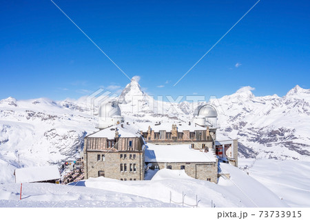The observatory on Gornergrat Summit overlooking Matterhorn as background in Zermatt, an iconic emblem of the Swiss Alps in canton Valais, Switzerland The observatory on Gornergrat Summit overlooking Matterhorn as background in Zermatt, an iconic emblem of the Swiss Alps in canton Valais, Switzerland 73733915