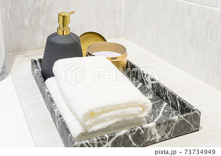 White spa towels on washbasin sink in hotel bathroom 73734949