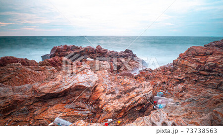 Long Exposure of Sea with Smooth Wave and Rock. Nature of Seascape abstract vacation travel in summer time. 73738563