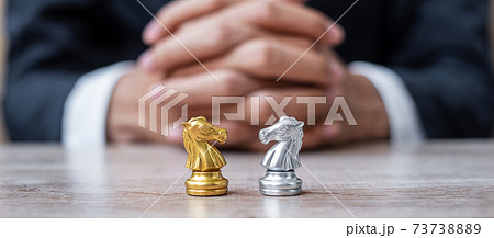 Gold and silver Chess Knight (horse) figure with businessman manager background. Strategy, Conflict, management, business planning, tactic, politic, communication and leader concept Gold and silver Chess Knight (horse) figure with businessman manager background. Strategy, Conflict, management, business planning, tactic, politic, communication and leader concept 73738889