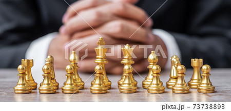 Gold Chess figure team (King, Queen, Bishop, Knight, Rook and Pawn) with businessman manager background. Strategy, Success, management, business planning, tactic, thinking, vision and leader concept Gold Chess figure team (King, Queen, Bishop, Knight, Rook and Pawn) with businessman manager background. Strategy, Success, management, business planning, tactic, thinking, vision and leader concept 73738893