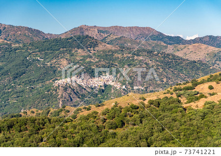 View of Francavilla di Sicilia and surrounding valley and mountains 73741221