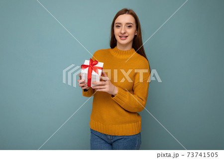Beautiful happy young brunette woman isolated over colourful background wall wearing stylish casual 73741505