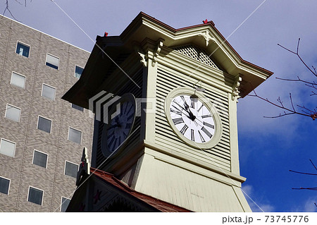 札幌市時計台の大時計と周辺の高層ビル 北海道札幌市中央区の観光名所の写真素材