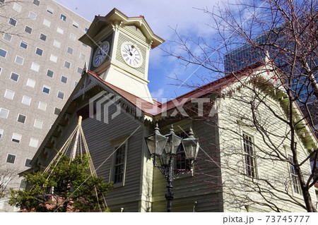 札幌市時計台の外観と周辺の高層ビル 北海道札幌市の観光名所の写真素材