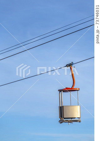 Sunlit ski lift with blue sky background in Utah 73746031