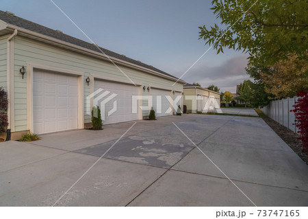 Receding row of garages on a housing estate Receding row of garages on a housing estate 73747165