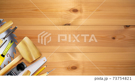 Tools of joinery craft or carpentry, composition on the wooden workbench background. 73754821