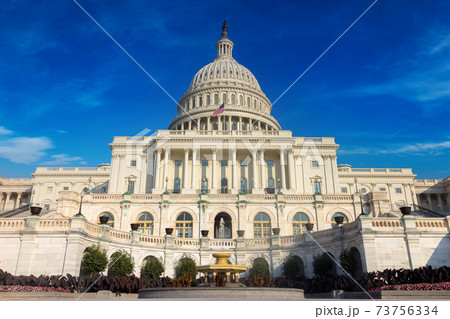 The United States pf America capitol building on a sunny day. The United States pf America capitol building on a sunny day. 73756334