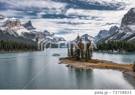 Spirit Island with ferry cruising on Maligne Lake at Jasper national park Spirit Island with ferry cruising on Maligne Lake at Jasper national park 73758833