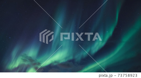Aurora Borealis, Northern Lights glowing in the night sky Aurora Borealis, Northern Lights glowing in the night sky 73758923