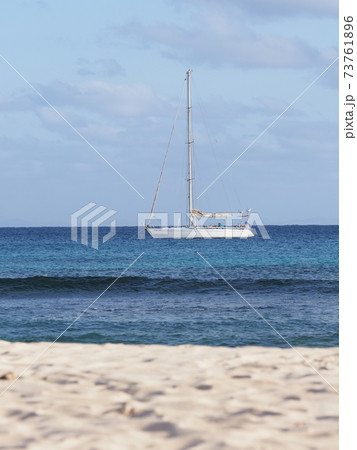 Beach with yacht on Atlantic Ocean, Sal island, Cape Verde - vertical 73761896