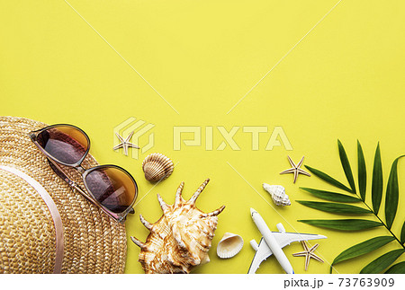 Traveler accessories on yellow background 73763909
