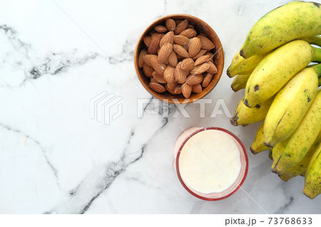 almond nut and milk on table top down almond nut and milk on table top down 73768633