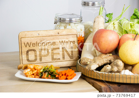 open sign on the table with fruits and vegetables open sign on the table with fruits and vegetables 73769417