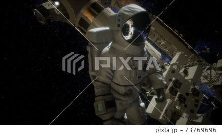 Astronaut outside the International Space Station on a spacewalk Astronaut outside the International Space Station on a spacewalk 73769696